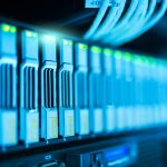 Detailed image of a server rack with glowing lights in a modern data center.